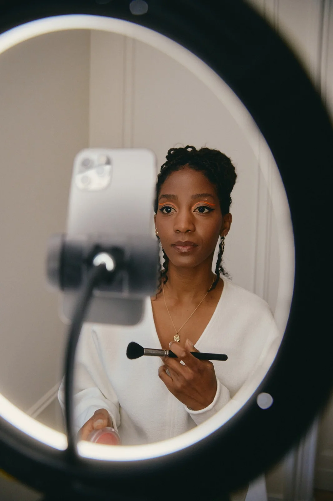 A person composing a photograph with a phone